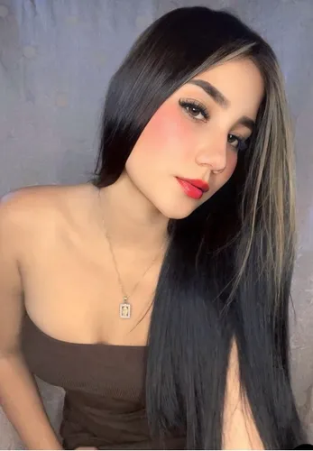 Young woman with styled hair waving hello on a video call