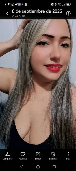 Young woman in a bright room looking at the camera during a video chat