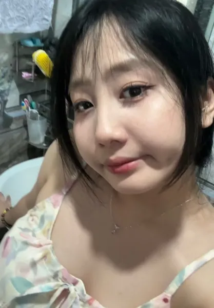 Smiling young woman with long dark hair on a one-on-one video call