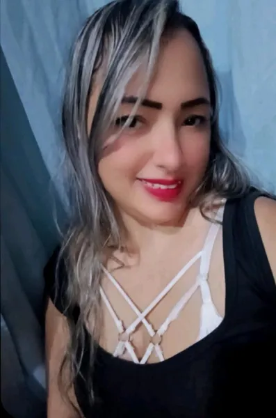 Young woman with long dark hair smiling on a live video call